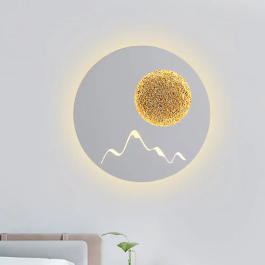 Nordic black white grey wall light fixture with textured golden sphere and minimalist mountain silhouette for bedroom use