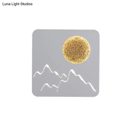 Gray square coaster with textured gold sphere and white mountain silhouettes for black white grey wall light fixture height