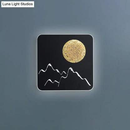 Black white grey Nordic wall light fixture with textured gold moon and white mountain silhouettes for bedroom use