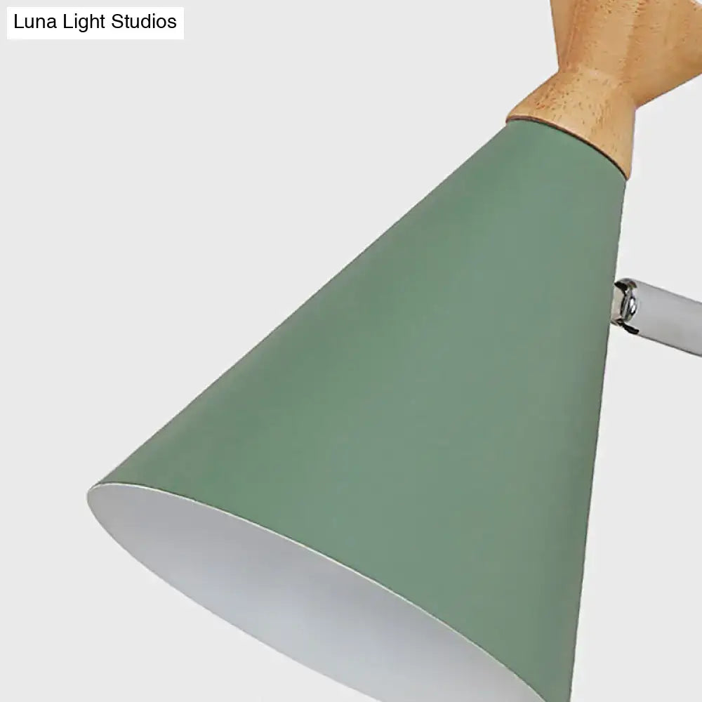 Nordic blue metal cone wall light with mint green metal cone shade, natural wood collar, and metallic arm for bedroom reading