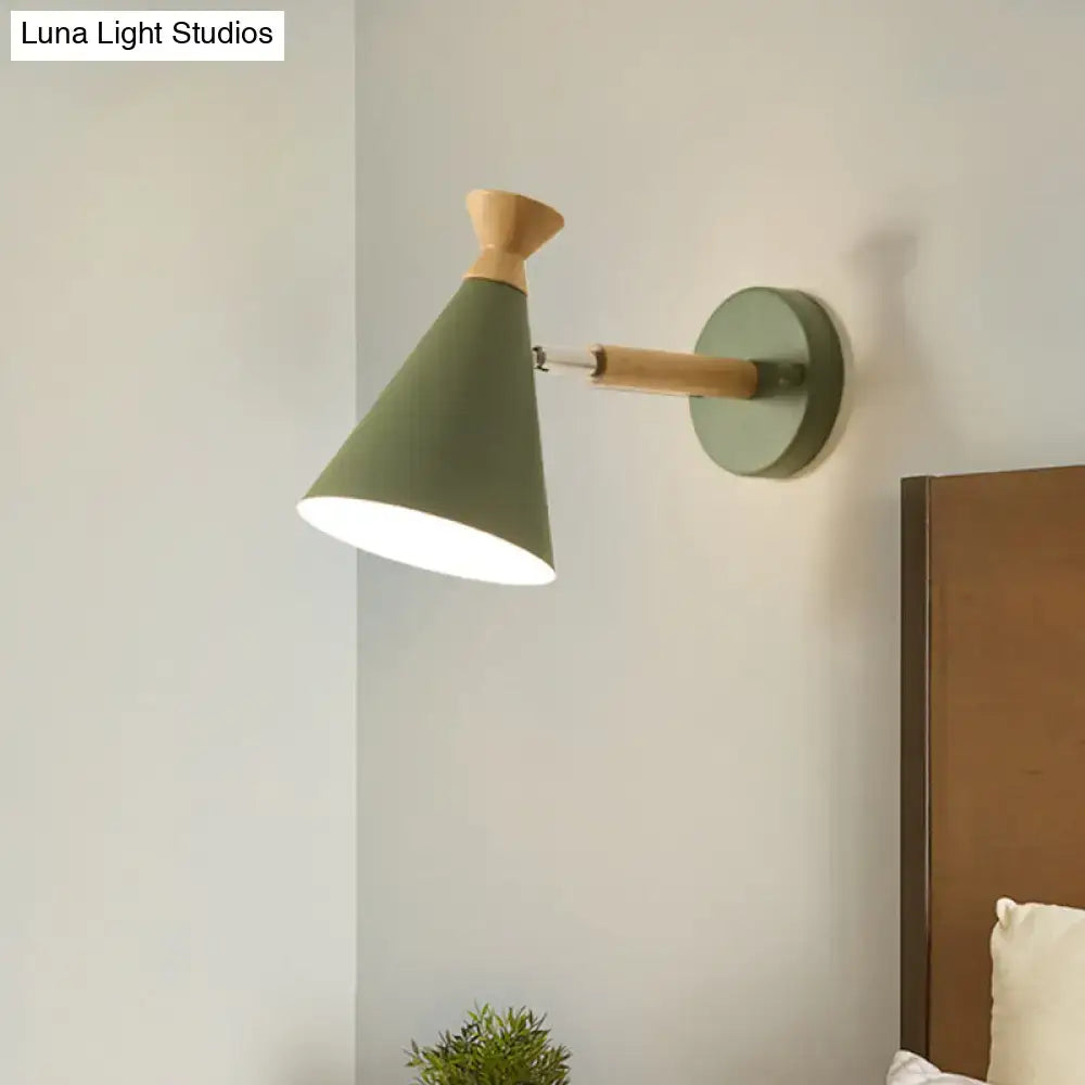 Olive green conical wall light with metal cone shade and natural wood finish featuring adjustable arm for reading