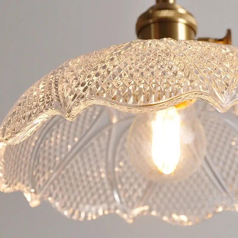 Nordic brass and clear glass led pendant light featuring a clear glass led scalloped edge and diamond pattern design