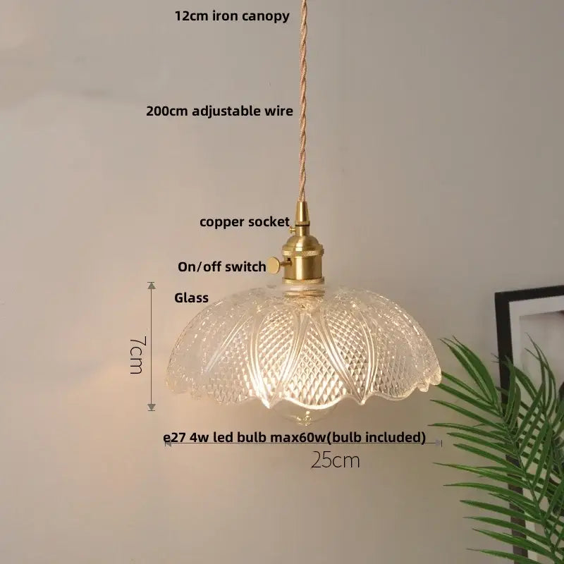 Nordic brass and clear glass led pendant light with intricate patterns and adjustable wire suspension for dining rooms