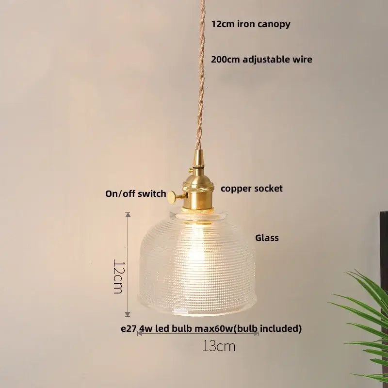 A warm-glowing nordic brass and clear glass led pendant light with textured dome for dining room decorbites clear glass
