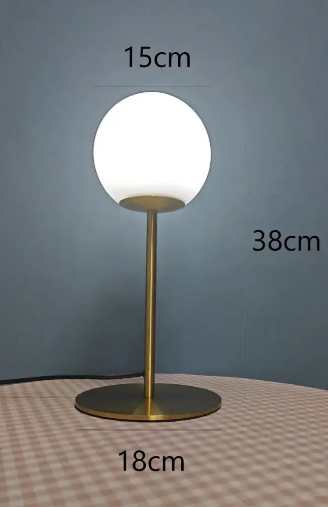 A sleek nordic brass and glass ball led table lamp with frosted white shade for bedroom decorbites glass ball decor