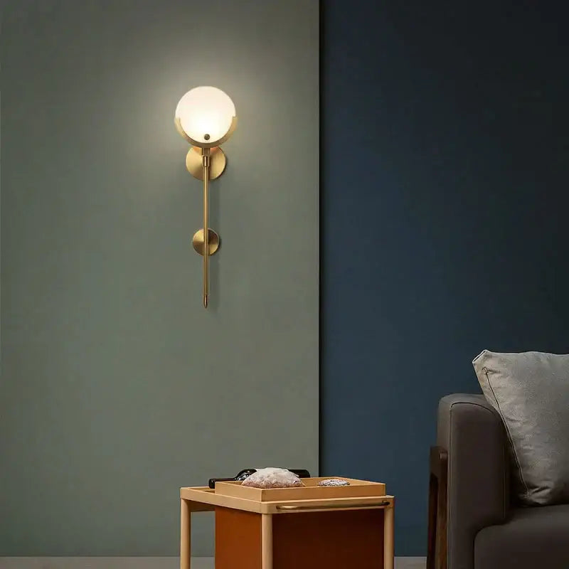 Nordic brass and marble wall lamp with gold-toned sconce and frosted glass shade for creative marble wall decorbites