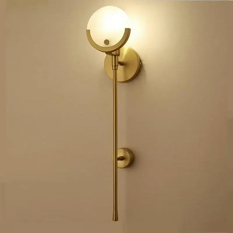 Nordic brass and marble wall lamp with frosted glass shade featuring a brass-finished stem by decorbites creative marble