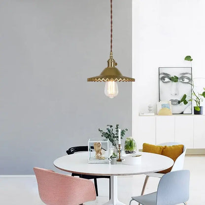 Brass pendant light with scalloped glass flounce led shade and exposed filament bulb for dining room lighting
