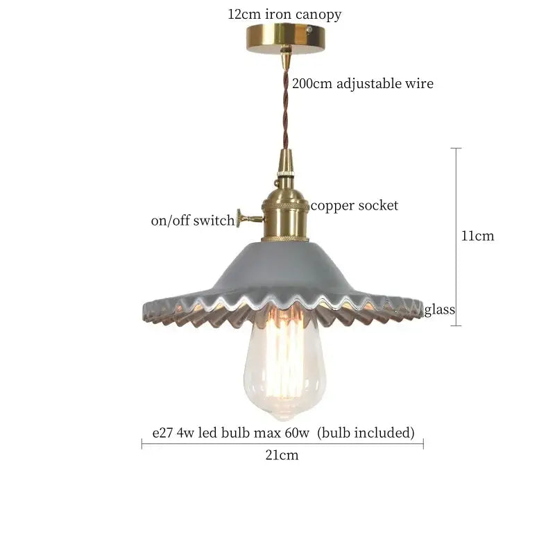 Gray scalloped glass flounce led pendant light with brass accents and visible Edison bulb for dining room use
