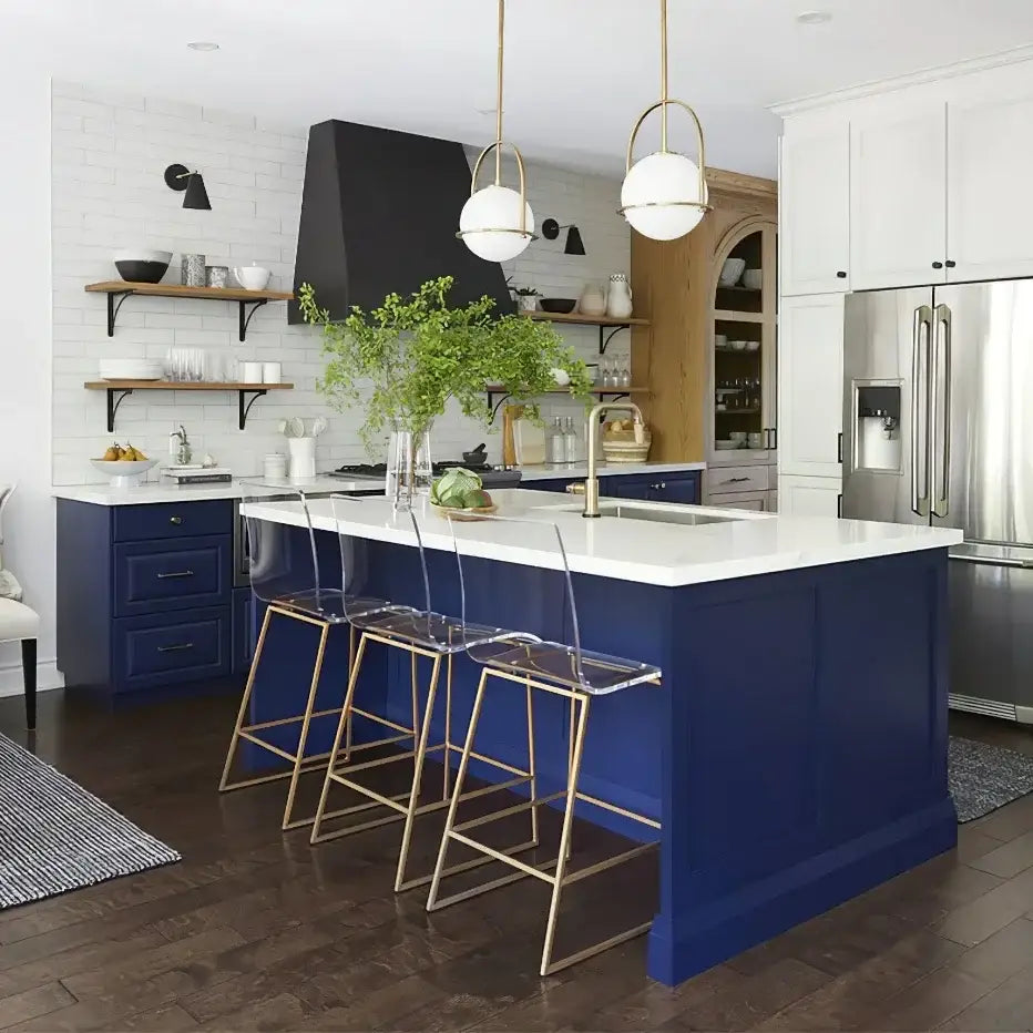 Blue kitchen island with white countertop and gold-toned stools under nordic brass glass globe pendant light decorbites glass globe