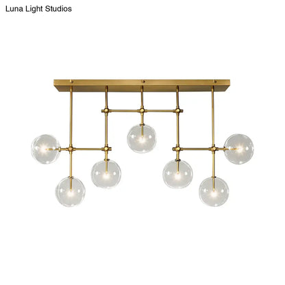 مصباح معلق على شكل جزيرة من DecorBites™ Nordic Clear Glass مكون من 7 لمبات باللونين الأسود والذهبي لغرفة المعيشة