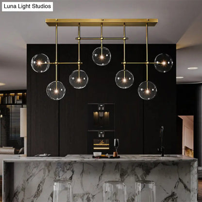 مصباح معلق على شكل جزيرة من DecorBites™ Nordic Clear Glass مكون من 7 لمبات باللونين الأسود والذهبي لغرفة المعيشة