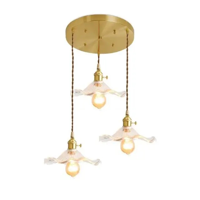 Gold-toned nordic pendant light with three translucent wavy glass shades and twisted copper chains for dining room copper led pendant