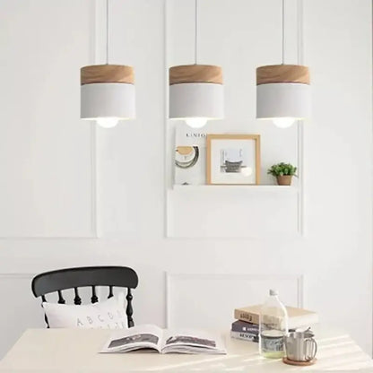 Three cylindrical pendant lights with white matte bodies and natural wood tops for living room decorbites colorful wood iron decor