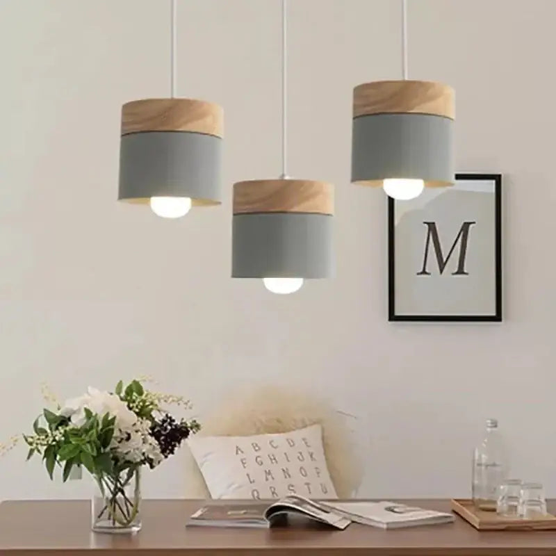 Three modern pendant lights with gray metal bodies and natural wood caps for living room decorbites colorful wood iron decor