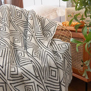 A cream-colored nordic cream and black grey knitted woolen blanket with bold geometric pattern for living room decorbites grey knitted throw