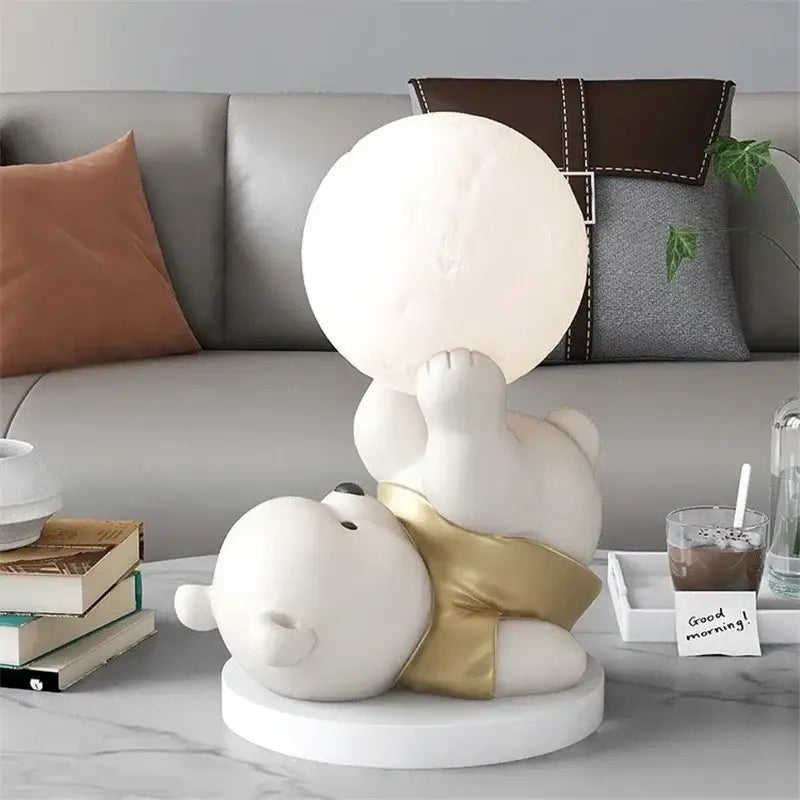 Nordic cream ceramic bear table lamp with white polar bear figurine wearing gold shorts holding a glowing orb
