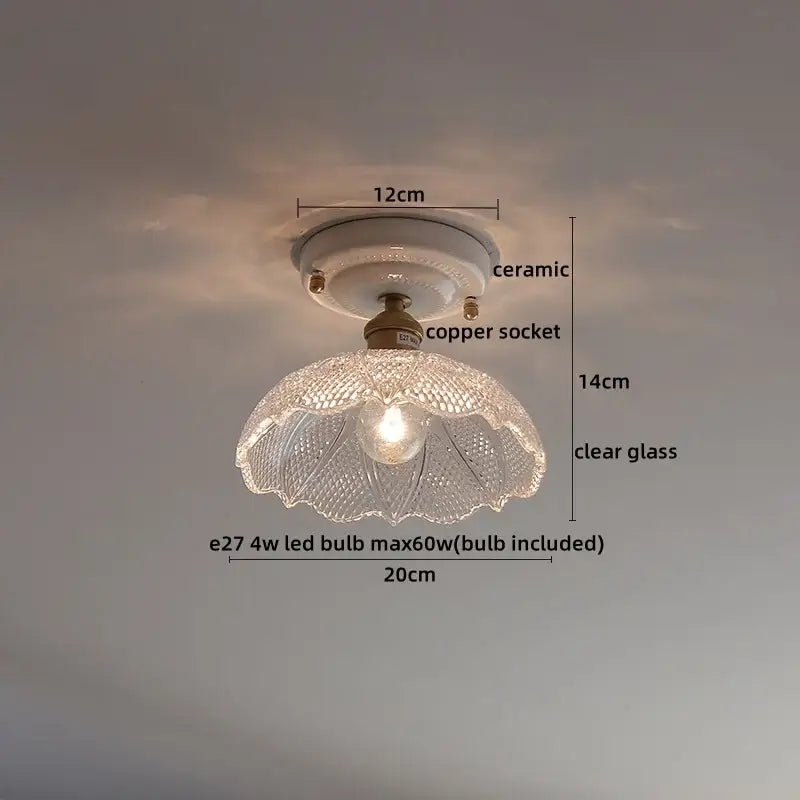 Nordic cream ceramic led ceiling light with clear glass lampshade and intricate cut patterns on copper socket base