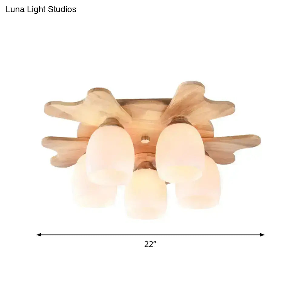 Nordic cream glass bell ceiling light with wood antler base and five frosted cream glass shades for bedroom use