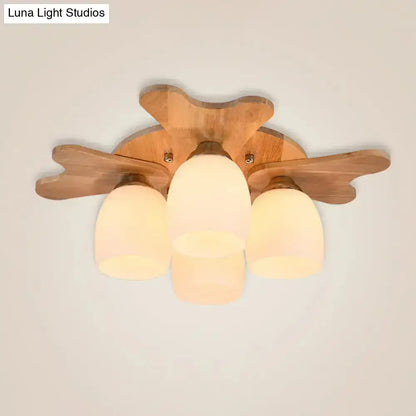 Nordic cream glass bell ceiling light with wooden leaf-shaped arms and three frosted glass shades for bedroom use