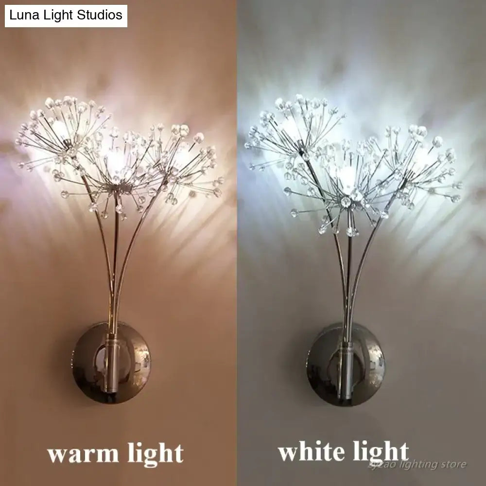 A sleek nordic creative crystal flower wall lamp with a metallic chrome base and delicate crystal-encrusted stems