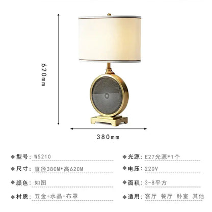 Nordic crystal table lamp with gold-toned brass base featuring crystal facets and off-white fabric shade for bedroom