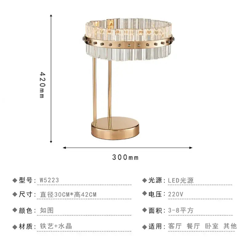 Nordic crystal table lamp with gold-toned metal base and circular clear crystal prisms for bedroom use