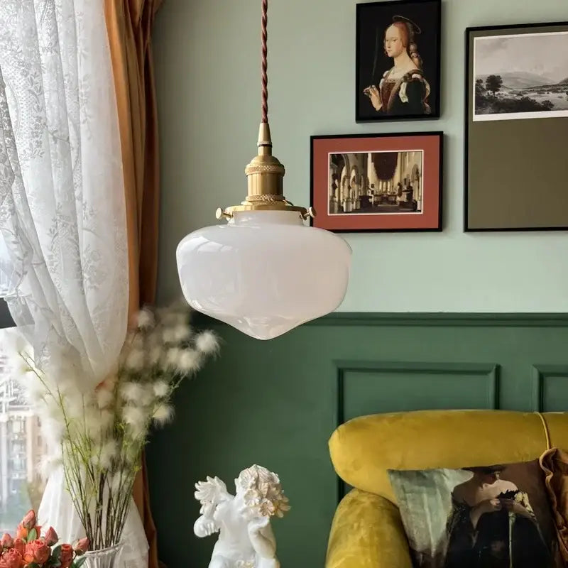 Nordic frosted glass led pendant lamp with brass hardware and twisted cord ideal as a bedroom pendant lamp