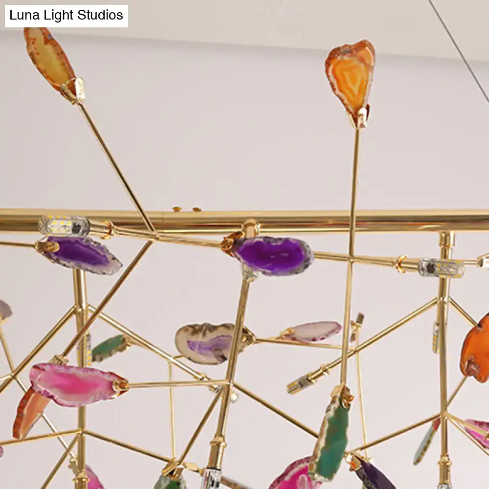 Modern nordic gold ceiling light with geometric brass frame and colorful geode slices for dining room use