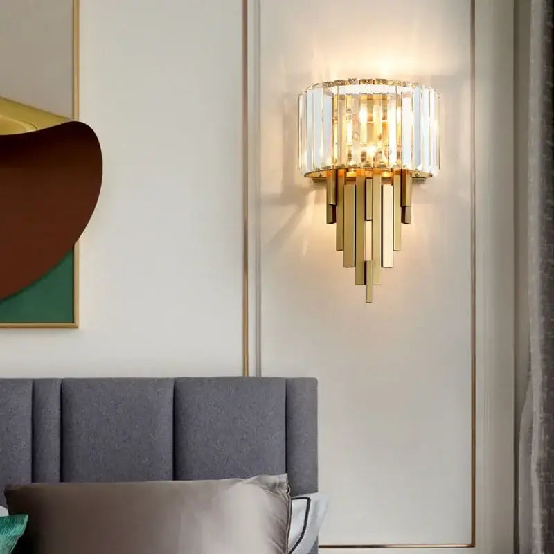 Gold-toned nordic crystal wall sconce with vertical rods and circular frame for living room decorbites crystal wall lighting