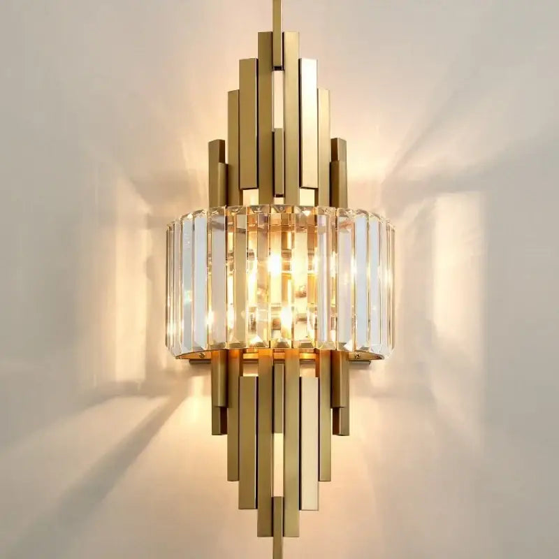 Gold-toned geometric crystal wall sconce with central cylindrical cage and brass bars for living room decorbites crystal wall