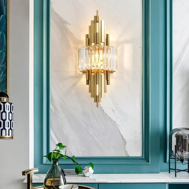 Nordic gold crystal wall sconce with vertical crystal bars and central glass element for living room decorbites crystal wall