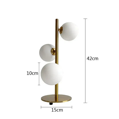 Modern brass table lamp with three frosted white glass ball led shades from decorbites for bedroom use