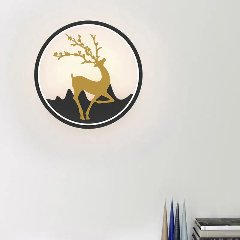 Nordic gold deer circle wall lamp featuring a golden deer silhouette on black mountain backdrop in sleek black frame wall lamp