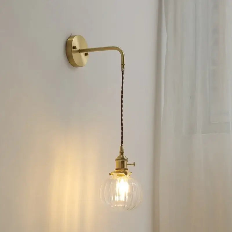 Nordic gold etched glass wall sconce lamp with brass fixture clear ribbed glass bulb and dark braided cord