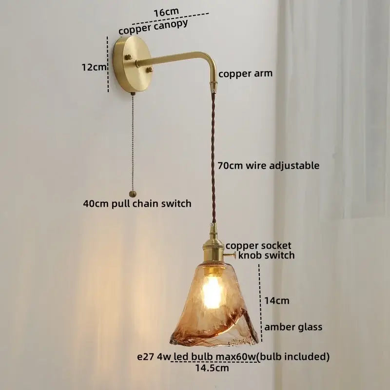 Copper wall sconce lamp with amber glass shade and adjustable arm featuring nordic gold etched glass and braided cord