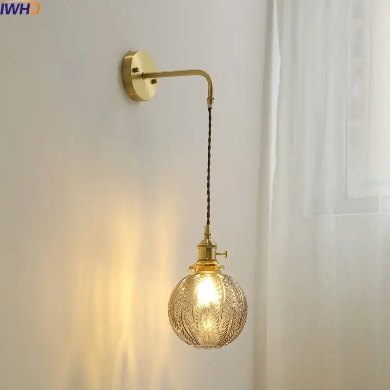 Nordic gold wall sconce lamp with spherical etched glass shade and braided cord for bedroom lighting