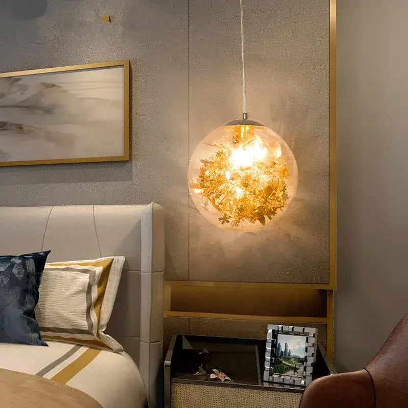 Nordic gold floral glass led pendant lamp with dried flowers inside suspended by a thin cord for kitchen lighting