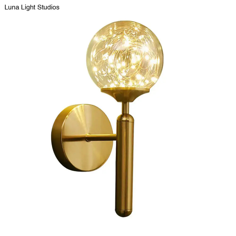 Nordic gold glass globe wall sconce with gold finish and warm led fairy lights for bedroom ambiance lighting