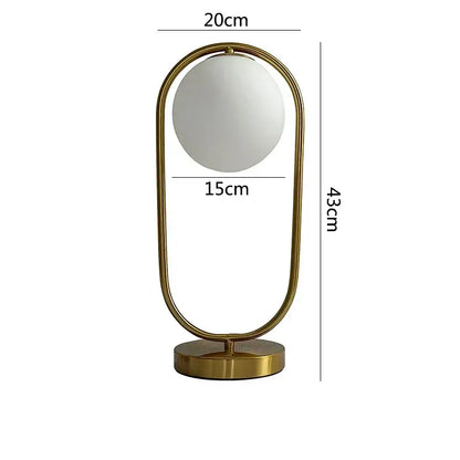 A nordic gold oval glass ball led desk lamp with a frosted glass ball and metal frame for bedroom decorbites glass ball