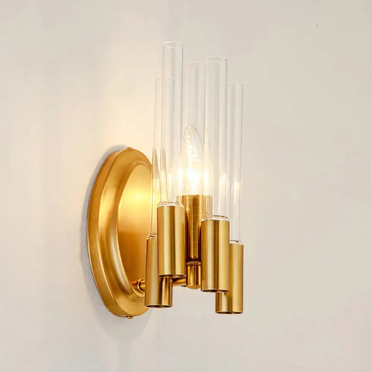 Gold-toned nordic wall lamp with five clear glass tubes and brass accents for living room lighting