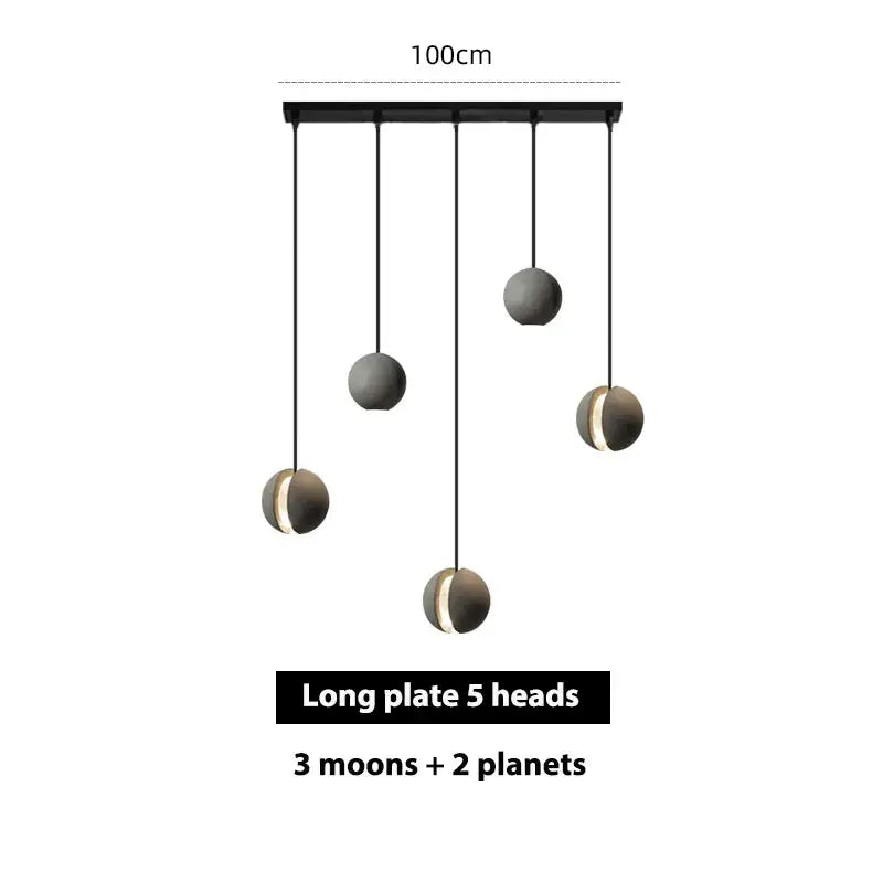 Modern black cement pendant light with five spherical globe shades resembling moons and planets for dining room decorbites cement pendant light