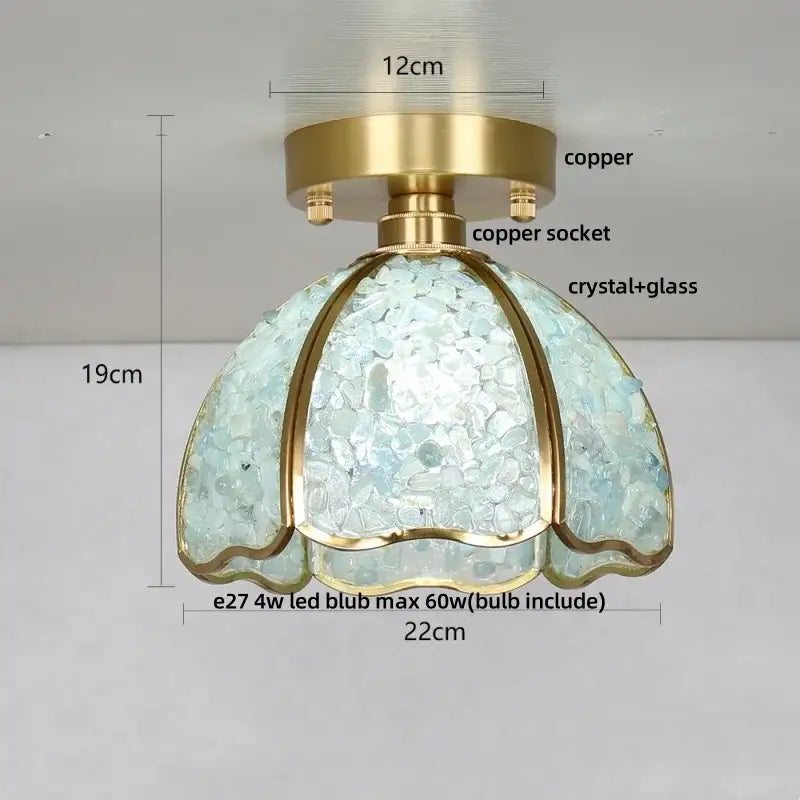 A delicate crystal ceiling light with blue glass mosaic dome shade and copper base for bedroom use