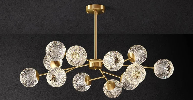 Gold-toned nordic pendant lamp with textured glass spheres for indoor dining room and living room lighting