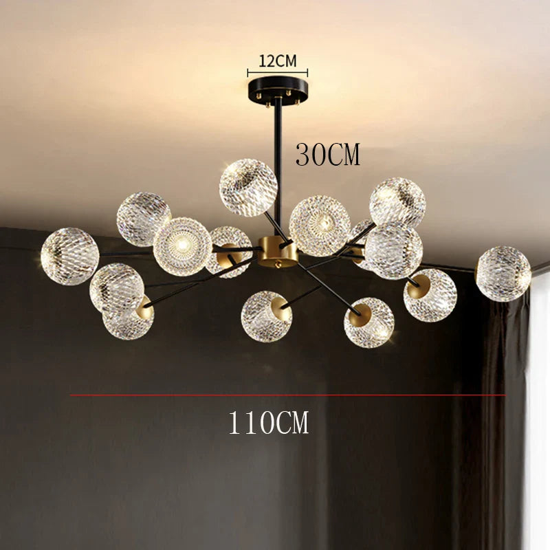 Modern chandelier with clear textured glass spheres on black and gold metal frame for nordic dining room lighting