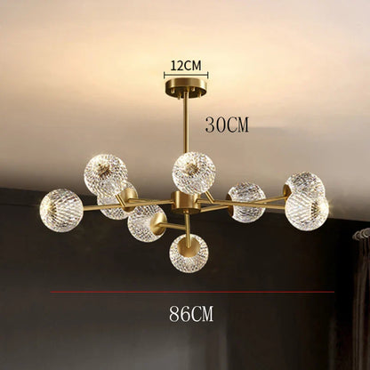 Gold-toned nordic chandelier with eight faceted crystal globe shades for dining room and living room lighting