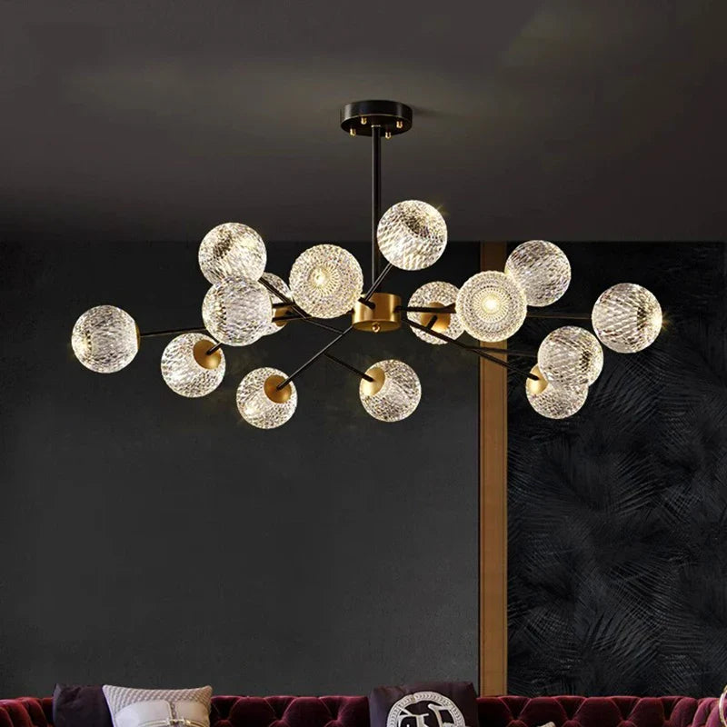 Modern chandelier with clear textured glass spheres on black and gold metal frame for Nordic dining room lighting