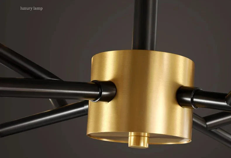 Gold-toned cylindrical pendant lamp with black metal arms for nordic dining room and living room indoor lighting
