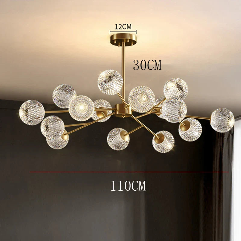 Gold-toned nordic pendant chandelier with clear textured glass spheres for indoor dining and living room lighting