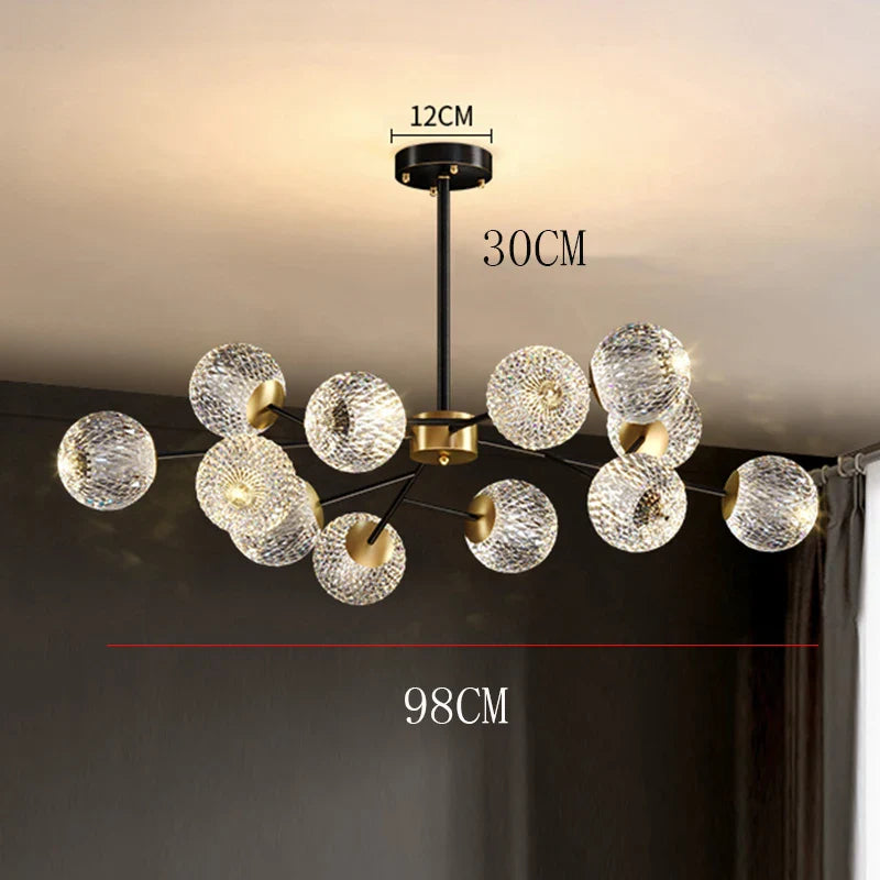 Modern chandelier pendant lamp with black stem gold accents and clear textured glass spheres for dining room lighting